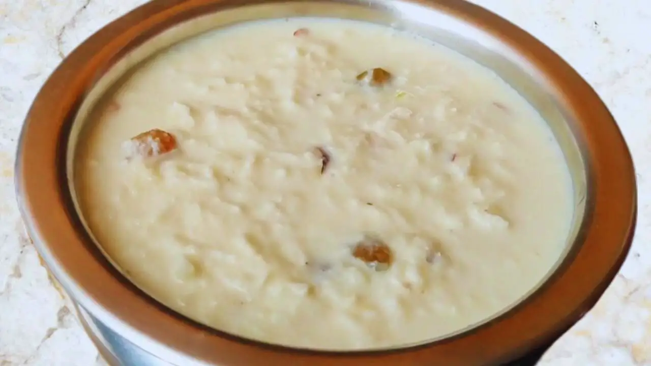 Transferring Coconut Kheer to a bowl to refrigerate 