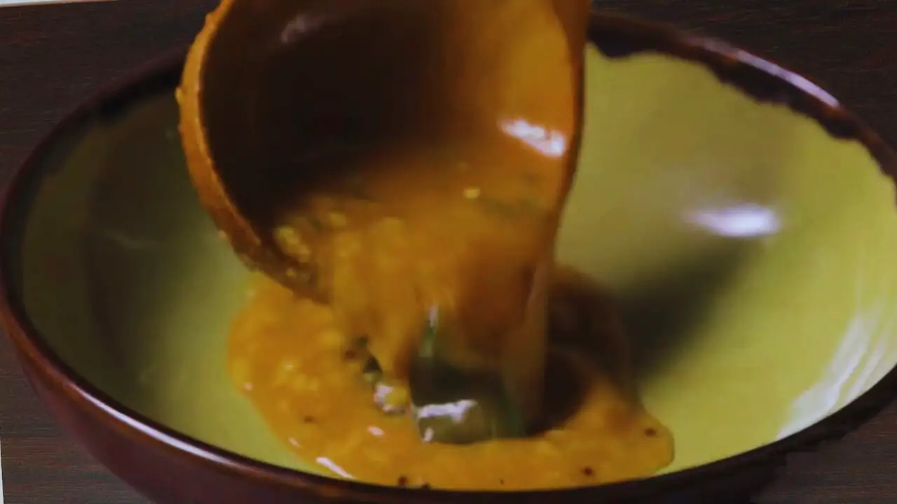 Transferring Toor Dal Soup to a bowl 