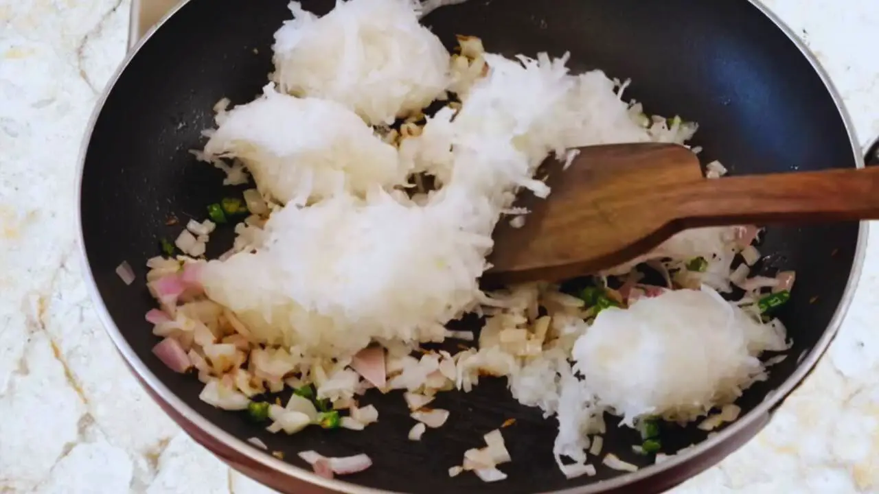 Mooli paratha recipe step 6 Adding grated radish