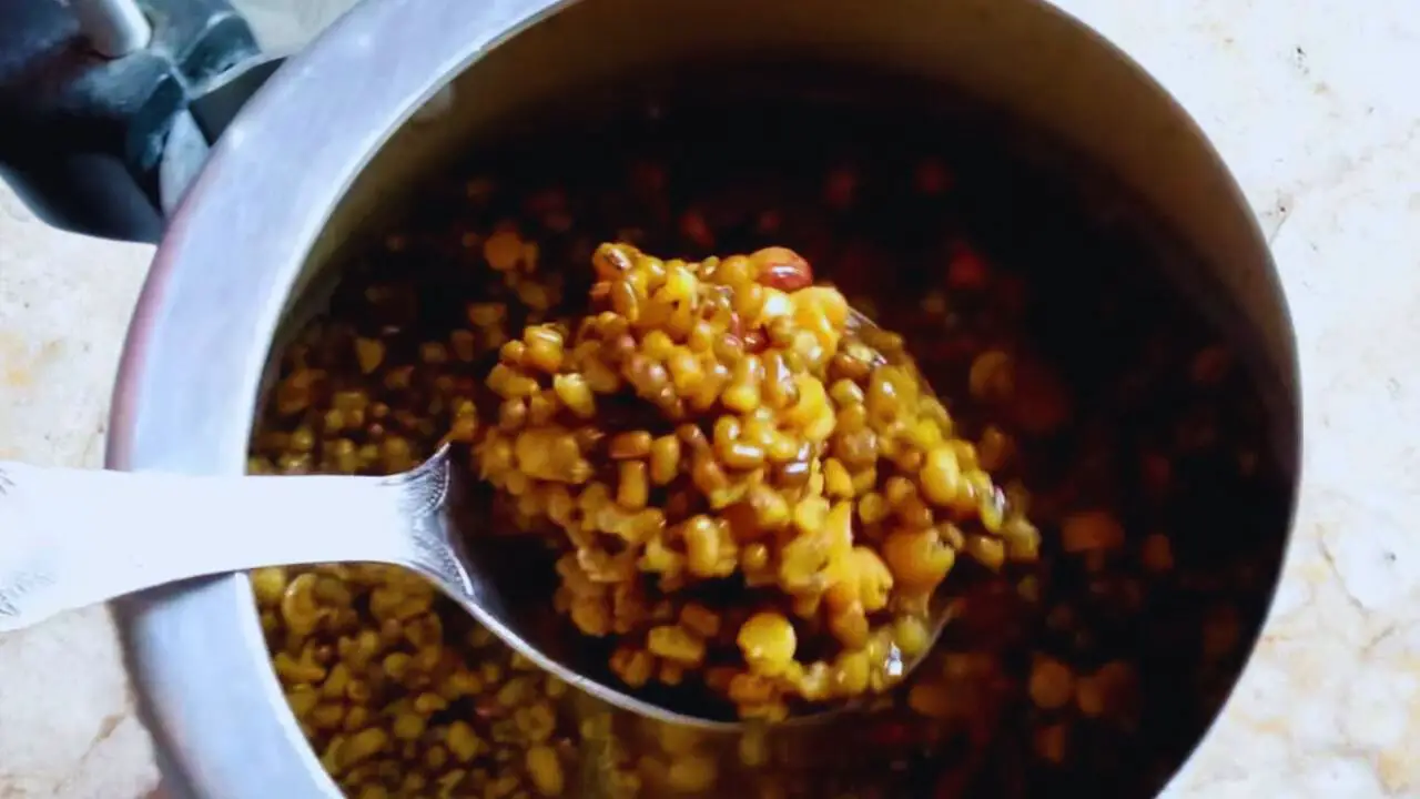 Checking doneness of dal