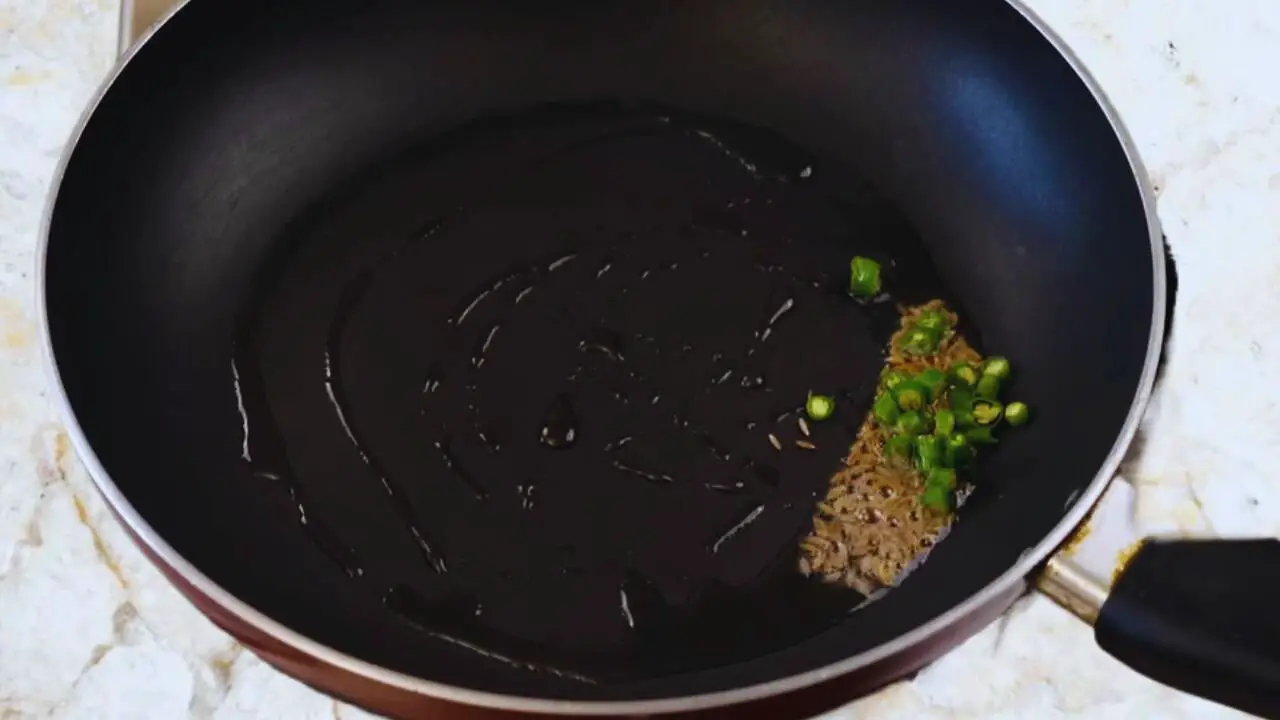 Mooli paratha recipe step 4 Frying cumin and chilies