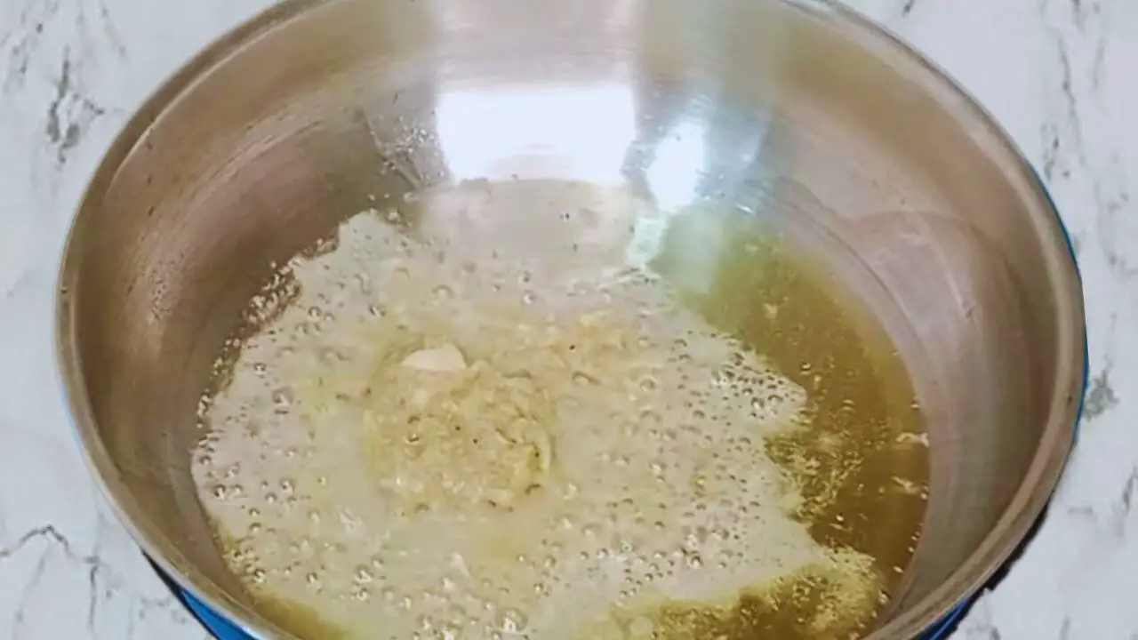 Prawn pockets recipe step 2 frying ginger and garlic