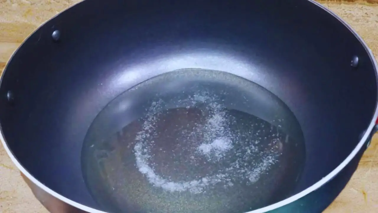 Kolhapuri fish curry recipe step 8 Heating oil with salt