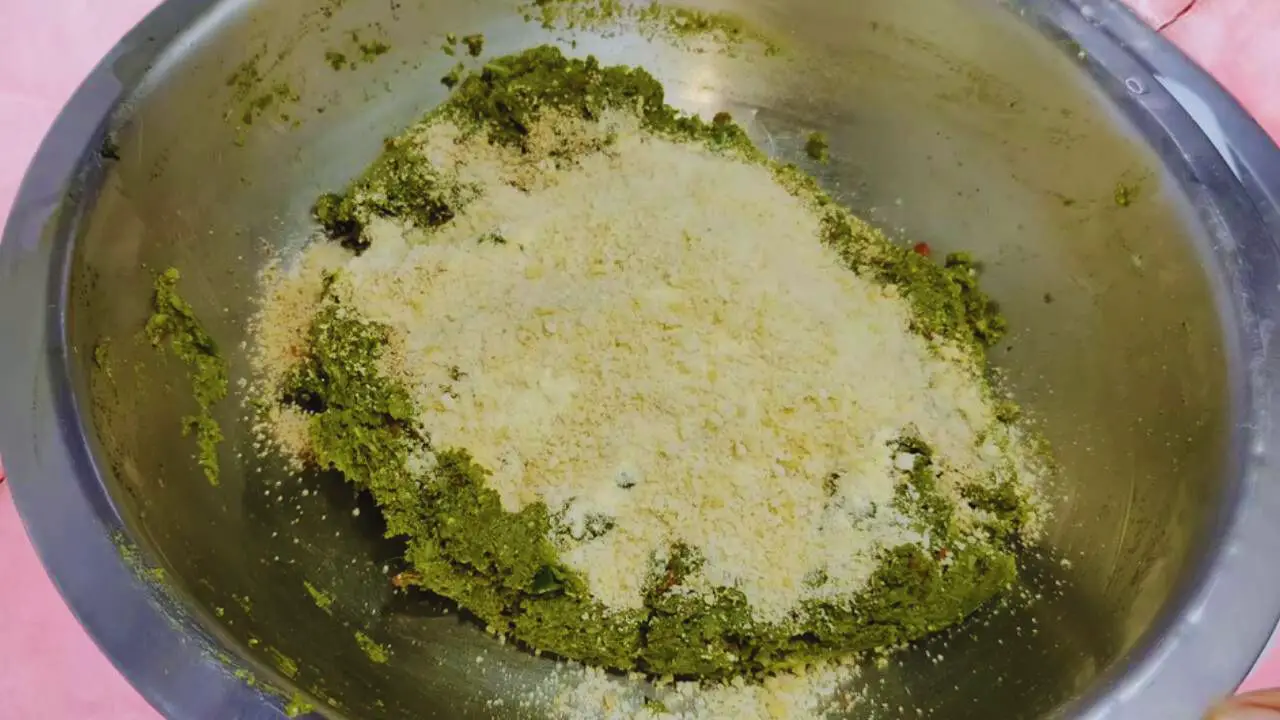 Adding chana dal powder, peanut powder, and breadcrumbs