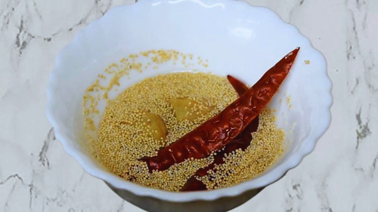 Soaking poppy seeds, ginger and red chilies before grinding 
